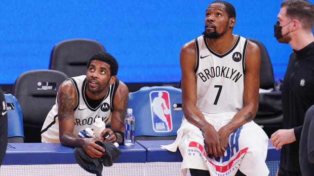 Brooklyn Nets' Kyrie Irving and Kevin Durant on the sideline